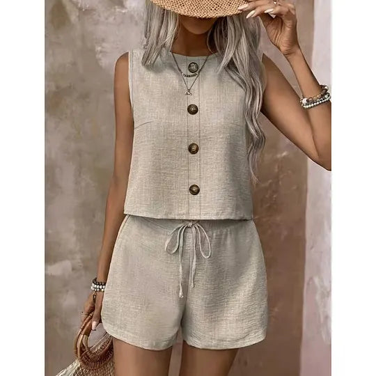 Women's sleeveless button-down blouse and shorts