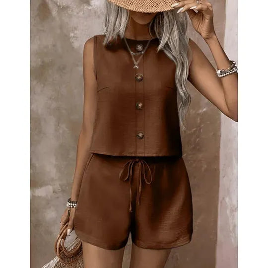 Women's sleeveless button-down blouse and shorts