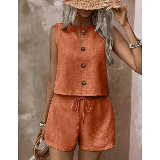 Women's sleeveless button-down blouse and shorts